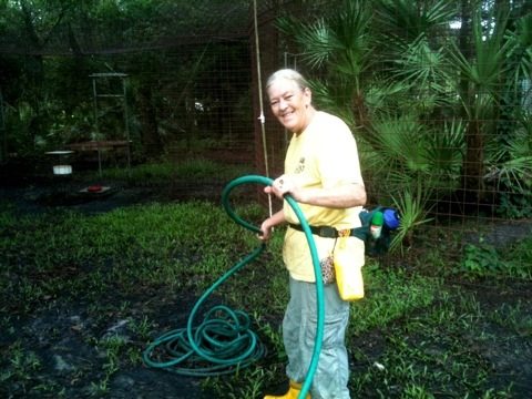 Kym Coiling Hoses Back Up After Cleaning Bobcat Cages
