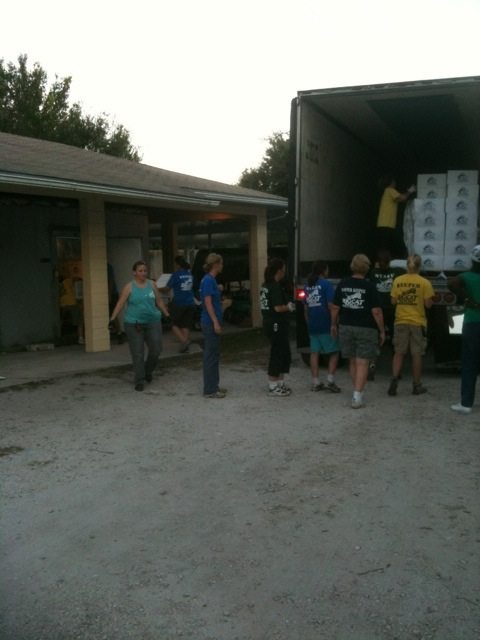 Unloading thousands of pounds of "cat food" in the early morning light