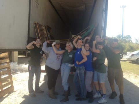 This happy crew just unloaded a semi of lumber and one of meat