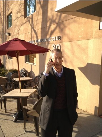 Howie takes a call outside the Democratic Club in Washington, DC