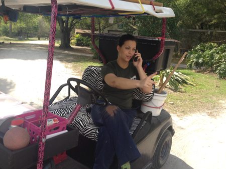 Jennifer Flatt kidding around on Jamie's golf cart
