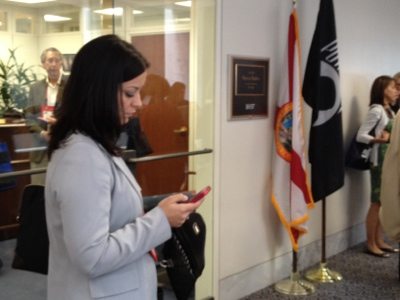 Jennifer checks facebook in between meetings with her lawmakers