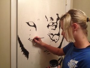 Intern Nicole paints on the back of the door in gift shop  Today at Big Cat Rescue Sept 7 Humane Society Grand Opening 20120907 190640