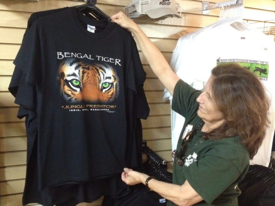 Pam Rodrigues stocks the Trading Post Gift Shop w/ cool shirts