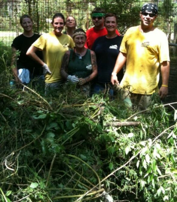 Volunteers Cleaning a 3 Acre Cage